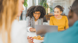 Two women looking at a laptop screen